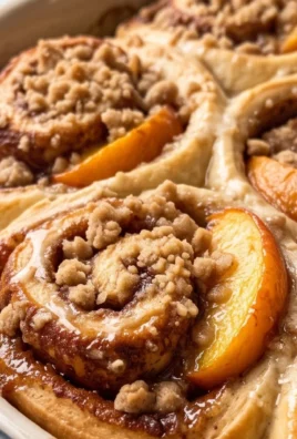 Peach Cobbler Cinnamon Rolls with Crum extractb Topping