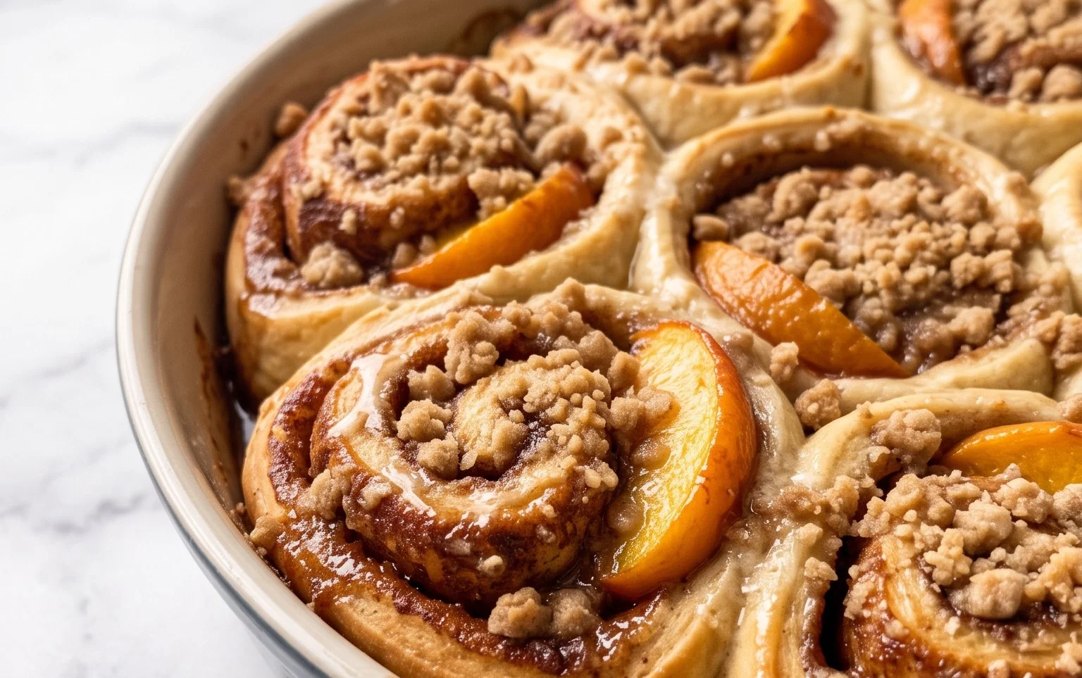 Peach Cobbler Cinnamon Rolls with Crumble Topping